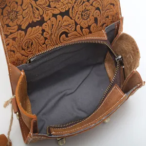 Vintage genuine leather women crossbody handbag featuring floral embossed flap and zipper.