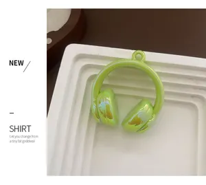 Glossy green headphone acrylic pendant charm for DIY crafts, keychains and phone straps.