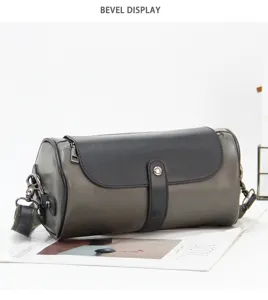 Detailed view of the retro cylindrical leather shoulder bag, showcasing premium texture and flap.