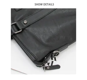Black leather men's business briefcase detail shot with metal zipper and hardware.