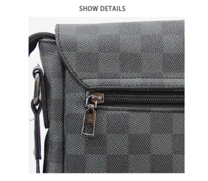 Detailopname grijze ruitjes heren schoudertas flap ritsvak textuur kwaliteit tas leder.