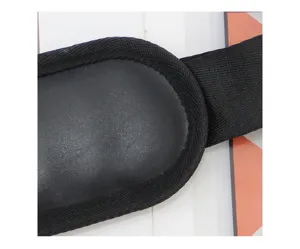 Black shoulder bag strap pad detail view, showcasing durable webbing and soft textured material.