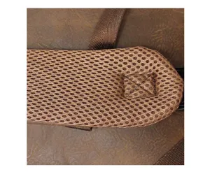 Close-up detail of the breathable mesh shoulder strap on the retro men's casual backpack.
