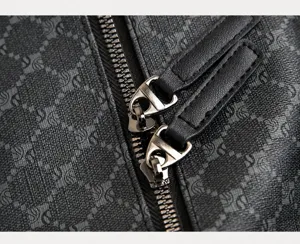 Close-up detail of men travel bag featuring durable metal zippers and premium pullers.