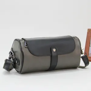 Men's casual cylindrical shoulder bag, stylish street style messenger bag for daily use.