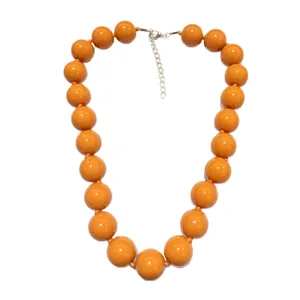 Chunky orange statement necklace for women, bold acrylic round bead bohemian jewelry.