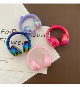 Close-up detail of colorful electroplated headphone charms, shiny DIY jewelry accessories.