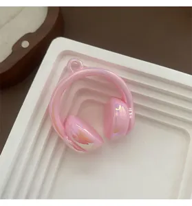 Pink pearlescent headphone charm detail, glossy acrylic DIY pendant for keychain item.
