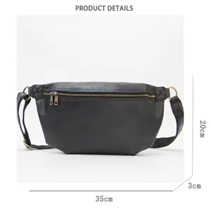 Detail view of black leather chest bag with zipper pocket and adjustable straps, size 35x20x3cm.