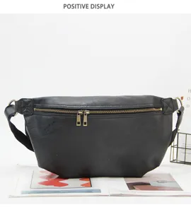 Black leather chest bag for men, stylish crossbody fanny pack with dual zippers and strap.