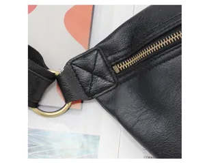 Men casual chest bag black leather sling bag zipper and metal ring detail close up shot view