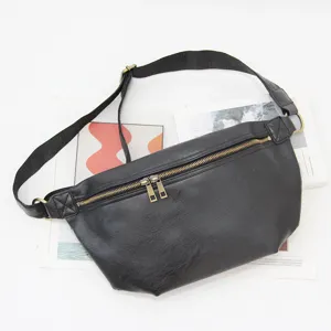 Stylish black leather chest bag for men, casual crossbody fanny pack with adjustable strap.