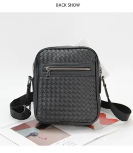 Detailed view of black woven leather men's shoulder bag with front zipper pocket and strap.