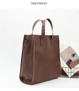 Sac d'affaires marron pour homme vue de côté montrant grande capacité et poignées doubles.