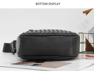 Bottom detail view of black handmade woven leather bag showing exquisite craftsmanship.