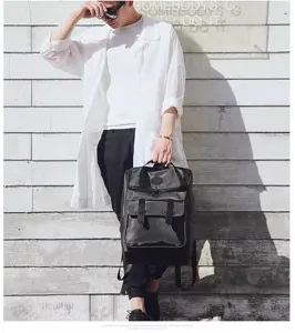 Detail view of black oxford waterproof backpack, large capacity travel and school bag for men.