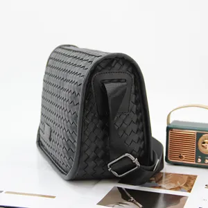 Men's black woven crossbody bag, stylish casual shoulder bag with adjustable strap.
