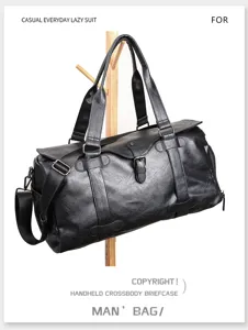 Black PU leather travel duffel bag detail, large capacity weekend bag with shoulder strap.
