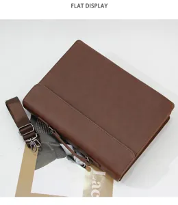 Detail view of brown vintage leather briefcase, casual business messenger bag with strap.