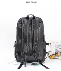 Detailed back view of the black leather business backpack, showcasing comfortable straps.