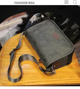 Detail shot of men's dark gray crossbody messenger bag, casual style with adjustable strap.