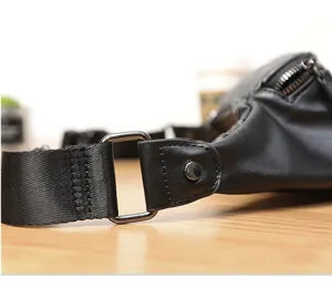 Men casual leather chest bag detail close up durable black waist pack with metal hardware