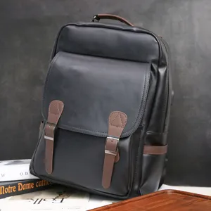 Classic black leather business backpack for men, large capacity travel school bag.