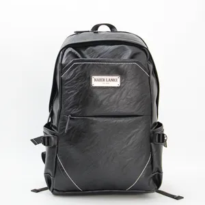 Black leather business casual backpack with front metal plate, stylish travel laptop bag.