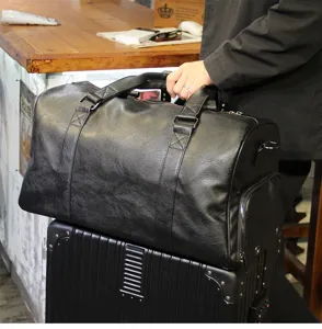 Black leather travel duffel bag, large capacity business luggage bag for short trips.