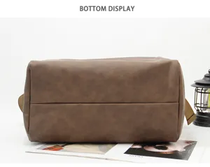 Bottom view of the dark brown thick soft leather shoulder bag showing detailed stitching and shape.
