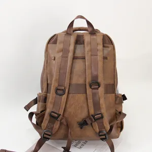 Vintage brown leather backpack for men, casual student bookbag with multiple compartments.