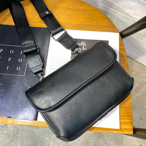 Men's black PU leather crossbody bag, stylish casual messenger bag with wide strap for daily use.