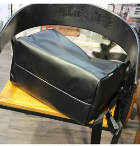 Premium black leather travel duffel bag for men, large capacity fitness gym bag with waterproof zipper.
