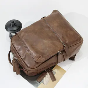 Vintage brown leather backpack for men, large capacity travel laptop bag, casual school bookbag.