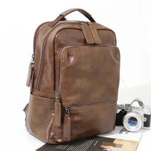 Vintage brown leather backpack for men, large capacity casual travel school computer bag.