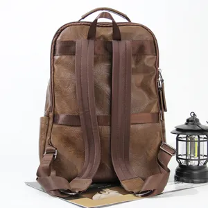 Vintage brown PU leather backpack for men, casual large capacity travel computer bag.