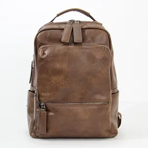 Vintage brown leather backpack for men, large capacity travel computer school bag daily use.