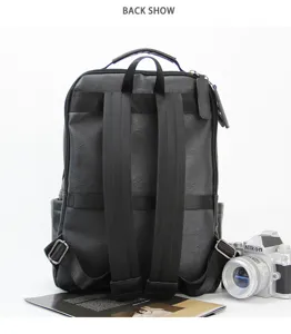 Classic black leather backpack for men, casual business laptop bag with durable straps and storage.