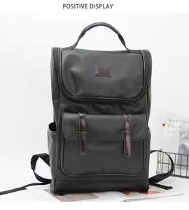 Detailed view of the Korean style commuter laptop backpack in dark color with multi pockets.