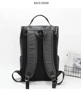 Detailed view of the dark grey leather backpack showing back straps, mesh padding, and handle.