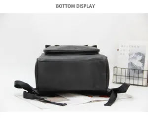 Detailed bottom view of black leather travel laptop backpack, large capacity outdoor school bag.