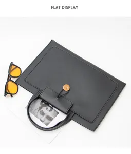 Slim black laptop bag portfolio document handbag with wooden button detail and round handles.