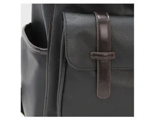 Black faux leather backpack detail view showing pocket and strap craftsmanship design.