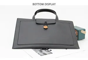 Slim black 13 inch laptop bag business briefcase sleeve with handle and wooden button closure.