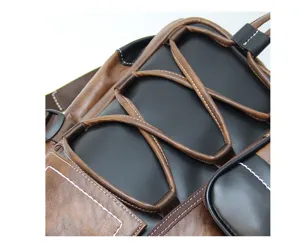 Detail shot of vintage brown and black patchwork backpack featuring durable synthetic leather and zipper.