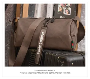 Casual brown mens shoulder bag detail shot featuring stylish strap and urban street style design.