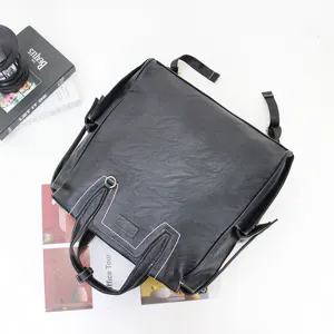 Stylish black leather backpack for men, large capacity business casual daypack with laptop compartment.