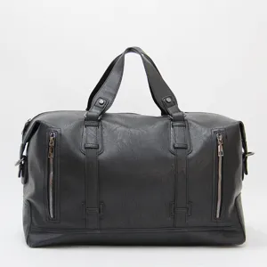 Black leather large capacity travel duffel bag for men, spacious weekender and gym bag.