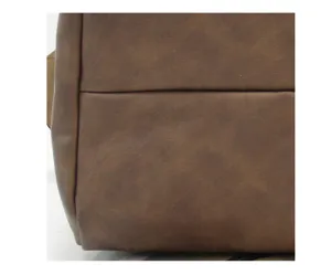 Brown soft leather bag detail close-up texture view, premium material and durable finish.