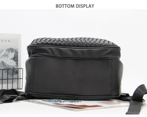 Woven leather business backpack bottom detail view, spacious travel rucksack design.